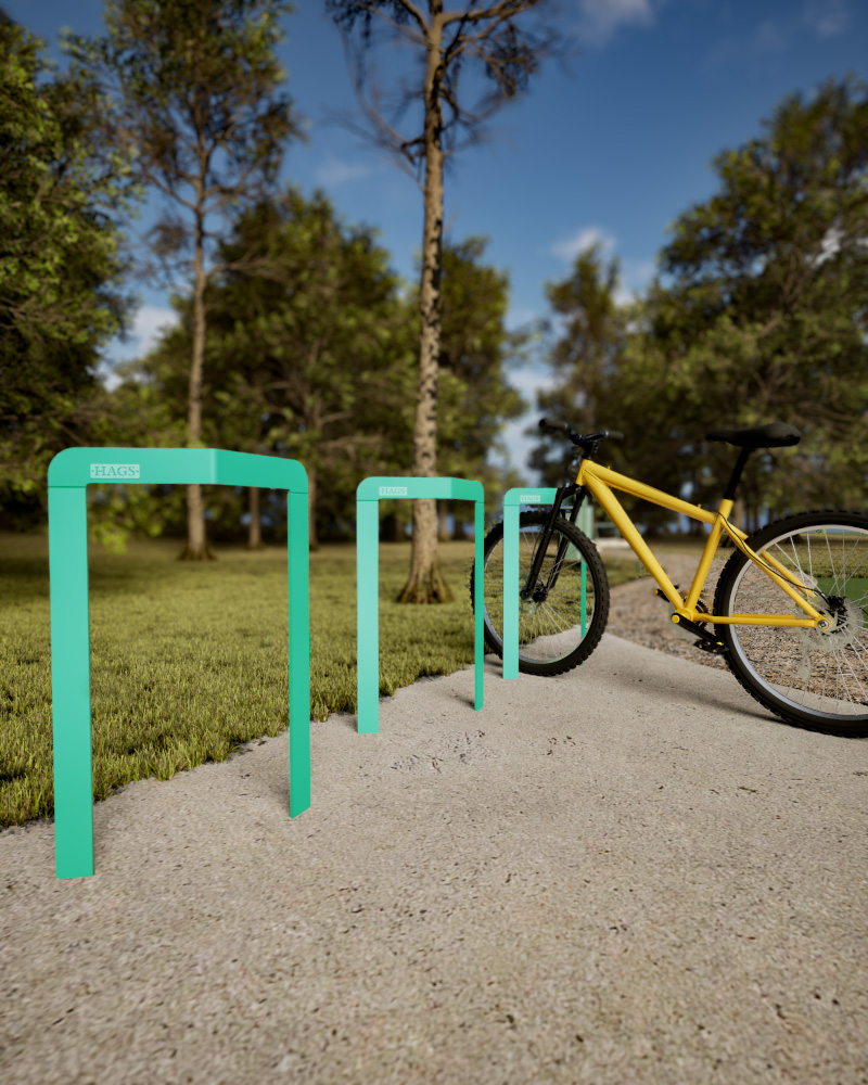 A render of the Rosenlund bicycle stand in a green park.